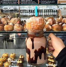 This Giant Milkshake Is Topped With A Giant Nutella Stuffed Donut Nutella Donuts Food Nutella