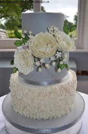 Silver And Ivory Wedding Cake Ivory Ruffled Detail Sugarcraft Roses And Peony In Ivory With Filler Flowers Ivory Wedding Cake Wedding Cakes Cake Pedestal