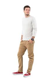Relaxed Man In Beige Pants And Gray Shirt Looking Behind Stock Photo Download Image Now Istock