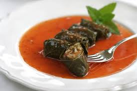 Pour chicken broth over all to cover grape leaves. Vegetarian Stuffed Grape Leaves Dolmades In Fresh Tomato Sauce Greek Food Greek Cooking Greek Recipes By Diane Kochilas