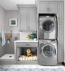 Laundry Room With Stacked Washer Dryer A Built In Dog Bed And A Dog Wash Laundry Room Renovation Laundry Room Diy Laundry Room Design