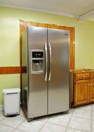 The fridge is on by itself wit ha wall on one side and. How To Build In Your Fridge With A Cabinet On Top Young House Love