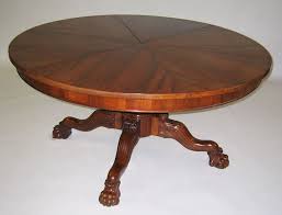 A Large Carved Walnut Expanding Circular Dining Table With A Segmented Top After Robert Jupe Raised On A Fo Circular Dining Table Dining Table Circular Table