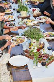 Bone up on an odd bit of history and then wash it down with a themed cocktail recipe; Group Of Friends Enjoying A Farm To Table Dinner Party Download This High Resolution Stock Dinner Party Summer Dinner Party Decorations Outdoor Dinner Parties