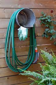 You can keep your garden hose neatly wrapped up and organized in this sturdy and attractive. Simple Designs That Can Replace Your Old Garden Hose Holder