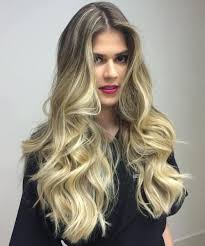 Using a curler, create waves on the lower half of your hair. 40 Cute Long Blonde Hairstyles For 2021