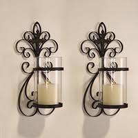 Go bold with something big and metallic and intricate like the sconces above. Wall Candle Holders Wish