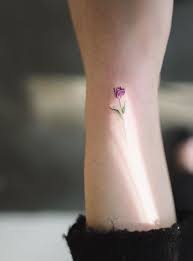 Tiny Colourful Tulip Tattoo On The Wrist Flower Tulip Tattoo Tattoos Wrist Tattoos For Women Tattoos For Daughters
