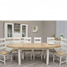 The dining table is very often the focal point of the room where you gather with your family and the good news is that smaller round tables come in models that can be expanded with an extension. Deluxe Painted Oval Extending Dining Table Chairs Set