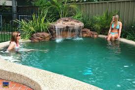Pool Waterfall Easy Way To Add Beauty By Clare Rich Swimming Pool Waterfall Pool Waterfall Backyard Pool