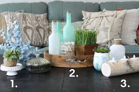 Decorating a coffee table often incorporates a few different elements. Coffee Table Decor Ideas Guide Ashley Homestore