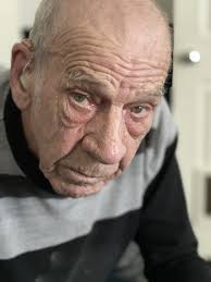 1954 photo off Church Street was 142 Varley Square being a shop with a post  box outside. A poster to the left was for the Regal Cinema advertising  Elephant Walk with Elizabeth
