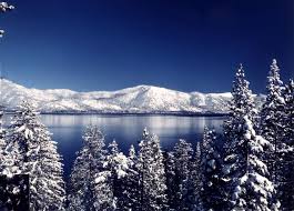 Lake tahoe is a popular summer destination thanks to its beaches and a popular winter vacation spot thanks to its slopes. Snow Capped Mountains Lake Tahoe Snow Lake Tahoe Winter Tahoe Winter