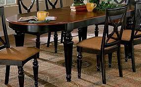 Farmhouse dining tables typically feature natural wood or distressed paint finishes. Kitchen Table Stained Top And Black Legs Northern Heights Oval Dining Table Black Base With Cher Formal Dining Room Sets Dining Room Sets Oval Table Dining