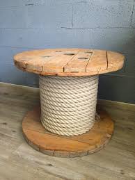 The table's rich stain hue highlights the wood's natural grain, creating a subtle sunburst effect. Wooden Spool Coffee Table 1980s For Sale At Pamono Spool Furniture Wood Spool Tables Cable Spool Furniture