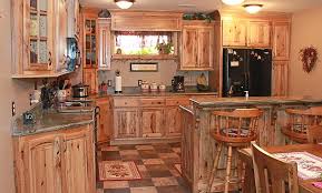 Hickory's grain is usually straight rustic hickory cabinets are more radical in color and grain variation, featuring irregular and wavy patterns. Pin By Susan Sauder On Kitchen Hickory Kitchen Cabinets Rustic Kitchen Cabinets Custom Kitchen Cabinets