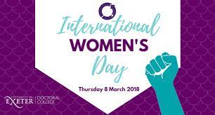 Women marching in the streets in demonstration with signs for suffrage on street in 1915. International Womens Day 2018 Doctoral College University Of Exeter