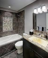 Monochrome colors the monochrome colors used throughout this bathroom's tiles all work in harmony for a clean, chic design. 130 Tile And Granite Bathrooms Ideas Granite Bathroom Bathrooms Remodel Tile Bathroom