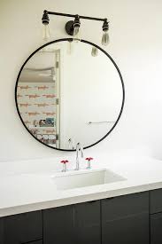Sometimes All You Need Is A Simple Round Mirror To Complete A Black And White Bathroom Bathroom Mirror Design Round Mirror Bathroom Large Bathroom Mirrors