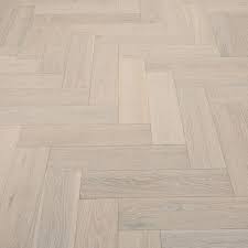 A Stunning Mix Of Rustic And Modern Whitewashed Herringbone Oak Has Mesmerising Tonal Variations And An Engineered Wood Floors Flooring Herringbone Wood Floor