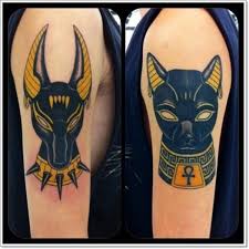 I am planning to get a tattoo. Black Ink Bastet And Anubis Egyptian Tattoos