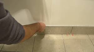 The wall surface must be smooth, level and clean. Inserting Capping Trim Into Skirting Tiles Youtube