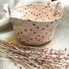 A large palm tree grows leaves that can be stripped and dried to create raffia strands. Saudi Palm Leaf Basket Large Multicoloured Saudi Gifts