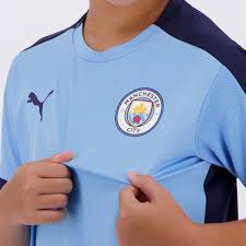 In the lower corner is red auerbach's signature with a quote. Puma Manchester City 2021 Teens Blue Training Jersey Futfanatics