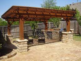 Elegant Outdoor Barbeque Area With Nice Dark Wooden Pergola Desogn And Stone Accents Home Living Bbq Ideas Outdoor Patio Designs Outdoor Pergola Patio Design