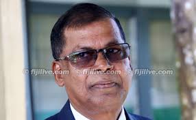 Prof Prasad pleads not guilty to both counts