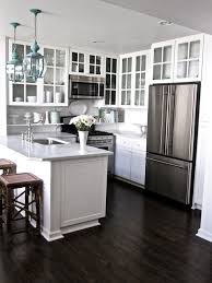 To create a new white kitchen cabinet look without extensive remodeling, simply remove the doors from a few upper cabinets. Glass Front Upper Cabinets Transitional Kitchen Grace Happens