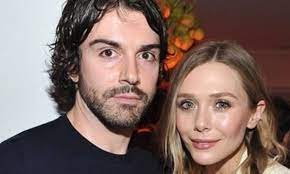 I also just noticed that my husband put 'little miss magic' [in. Robbie Arnett Everything About Elizabeth Olsen S Boyfriend Networth Height Salary