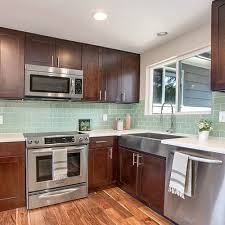 Furthermore, dark wooden cabinets fill the culinary space with warmth. Kitchen Backsplash Pictures Subway Tile Outlet