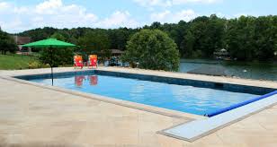 Simple Elegant Rectangular Gunite Pool Equipped With Automatic Cover Backyard Pool Landscaping Pool Builders Gunite Pool