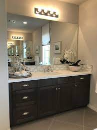 Bathroom Remodel Ideas Black Cabinets White Quartz Countertop Gray Tile Flooring White Quartz Countertop Bathrooms Remodel Quartz Countertops