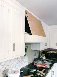 Vent your bath and kitchen exhaust fans through the roof through a special roof hood. Week 5 Diy Range Hood Cover Tiling Jenna Kate At Home