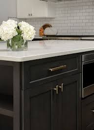 It is a custom kitchen island. 11 Easy Ways To Modernize Brown Cabinets Brown Cabinets Brown Kitchen Cabinets Rustic Kitchen Design
