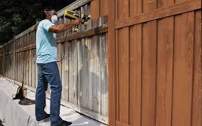 How To Paint A Wooden Fence With A Sprayer Wagner Diy Staining Wood Fence Fence Paint Colours Patio Fence