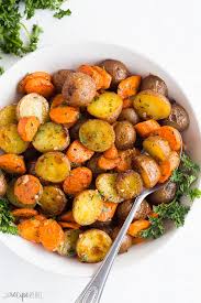 These Easy Roasted Potatoes And Carrots Are Tossed In Garlic Butter And Roasted To Perfe In 2020 Roasted Potatoes And Carrots Buttered Vegetables Healthy Salad Recipes