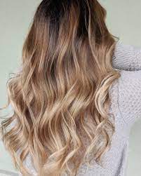 The dark roots melt into a stunning golden brown, which can help create thickness in the design. 38 Best Light Brown Hair Color Ideas According To Colorists