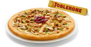 Place the dough on a large sheet of parchment paper, lightly grease your hands with oil, and push and flatten the dough to form the crust. Boston Pizza Bakes New Christmas Pizza Topped With Turkey And Stuffing In Canada Brand Eating