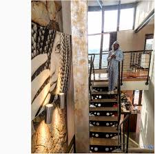 Somgaga has a lavish home featuring creature comforts like a designer kitchen, a lounge, suede coaches, a painting, and other things. Get A Peek Inside Somizi S Luxurious Home Okmzansi