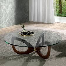 The beautiful organic walnut grain is highlighted in this simple contemporary coffee table. Contemporary Coffee Table 2053 Angel Cerda Tempered Glass Crystal Solid Wood Base