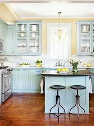 Duck Egg Blue Cabinetry Pale Yellow Walls And Marble Countertops Kitchen Cabinet Colors Blue Kitchen Cabinets Home Kitchens
