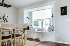 Baby room ideas, window seat with pillows, window decorating with curtains and colorful decorative balls. How To Build A Window Seat With Hidden Storage Sammy On State