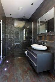 Here's a quick and easy bathroom decorating idea — change out your bathroom's hardware.new drawer pulls, towel bars, toilet paper holder, and faucet will completely change the look of your bath. Grey Brown Bathroom Ideas Houzz