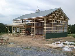 We installed blocking on the exterior frame and completed the heade. Pole Barn Bay Door Spacing Help The Garage Journal