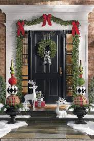 Although a wreath is traditional at christmastime, you can decorate your door with a minimal fuss swag using pine bunches instead. Christmas Porch Decorations 15 Holly Jolly Looks Grandin Road Blog