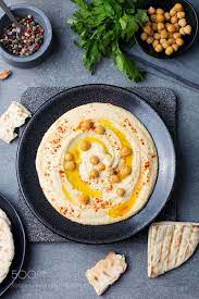 Hummus Chickpea Dip With Spices And Pita Flat Bread In A Black Plate Top View By Pustynnikovaa Diy Hummus Recipes Hummus Recipe Hummus