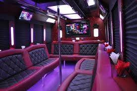 This beautiful party bus has a gorgeous interior with plush leather seats, wood floors, vibrant lights, a large tv and a dvd player, a booming sound system with a cd. Rb Lb Interior Angled 2 Sam S Limousine Charter Shuttle Coach Party Bus Rental Houston